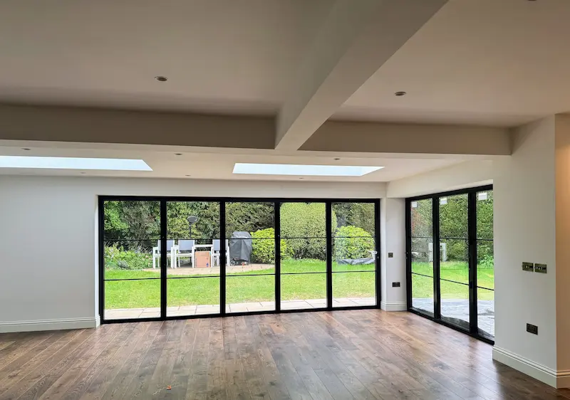 Stylish living area featuring dramatic black sliding doors